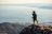 A man is taking a picture on top of the table mountain